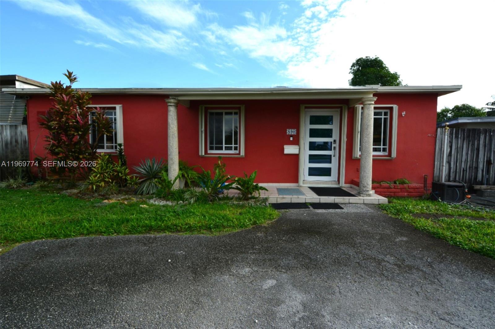 890 East 38th Street Hialeah, FL 33013 - Photo 3 of 30 a front view of a house with garden