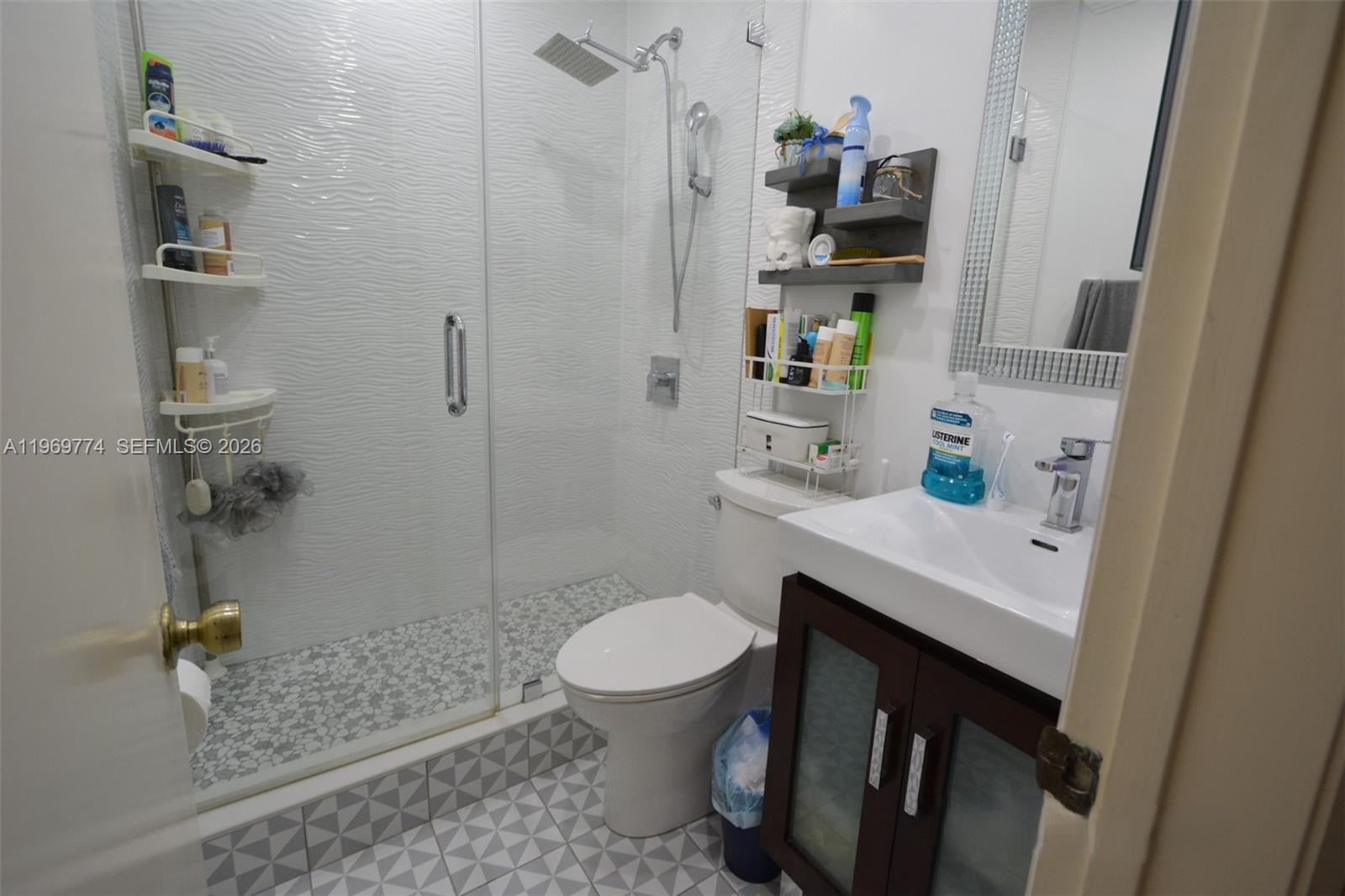 890 East 38th Street Hialeah, FL 33013 - Photo 9 of 30 a bathroom with a sink a toilet and shower