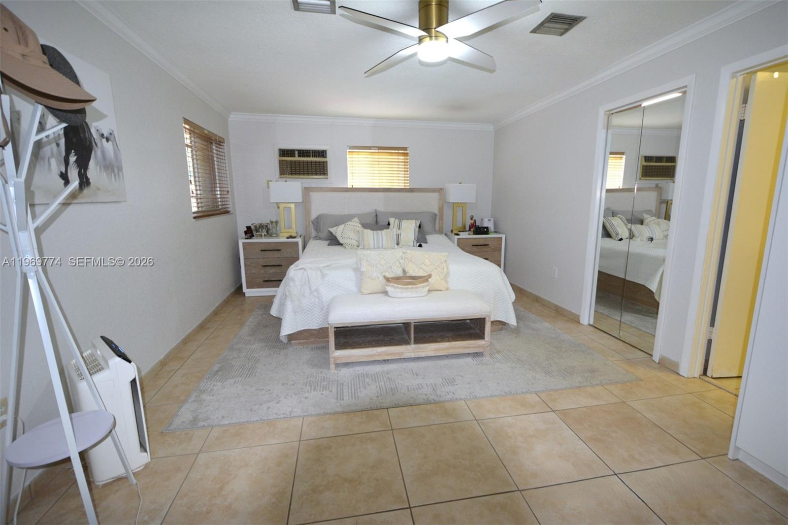 890 East 38th Street Hialeah, FL 33013 - Photo 10 of 30 a living room with furniture and a flat screen tv