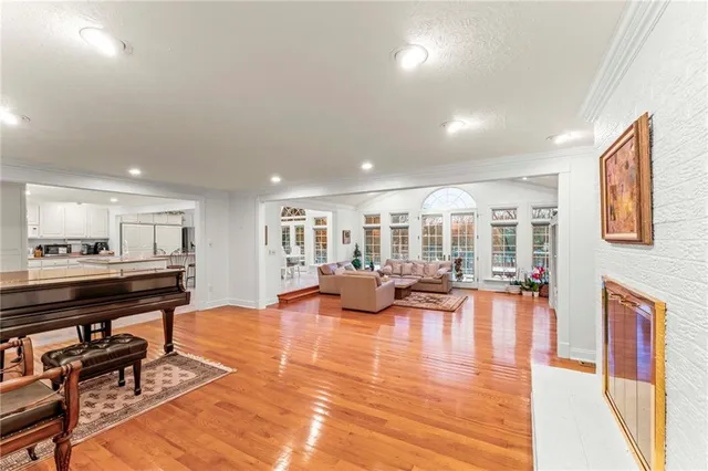 a view of a livingroom with furniture and a flat screen tv