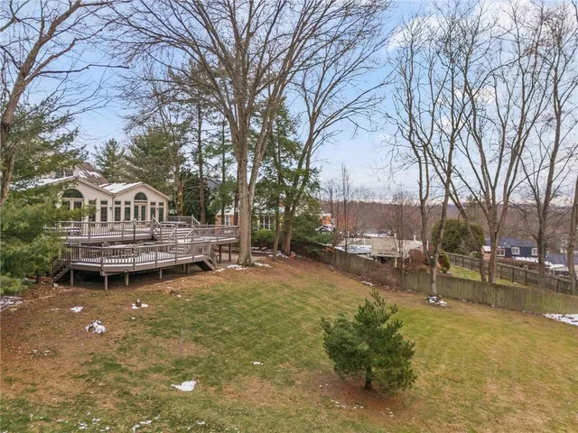 a backyard of a house with table and chairs
