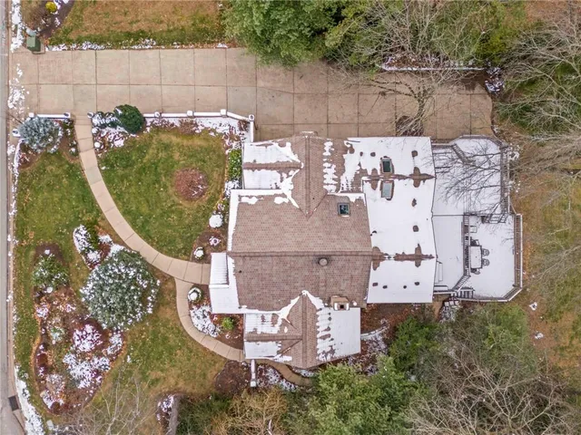 an aerial view of a house with outdoor space