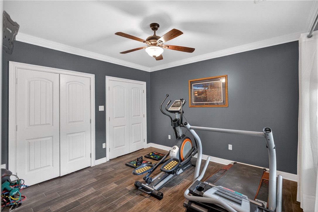 206 James Hare Road Anderson, SC 29626 - Photo 12 of 37 An inviting exercise room features durable wood-look tile flooring and crisp crown molding.