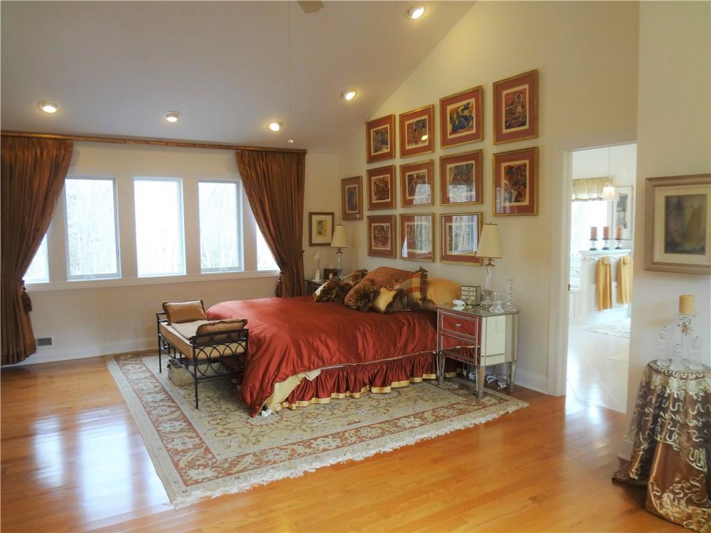 232 Devils Backbone Road New Castle, PA 16102 - Photo 15 of 25 a spacious bedroom with a bed and wooden floor