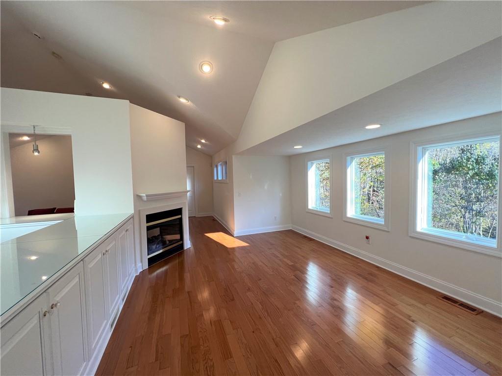 232 Devils Backbone Road New Castle, PA 16102 - Photo 17 of 25 a view of empty room with wooden floor and fireplace