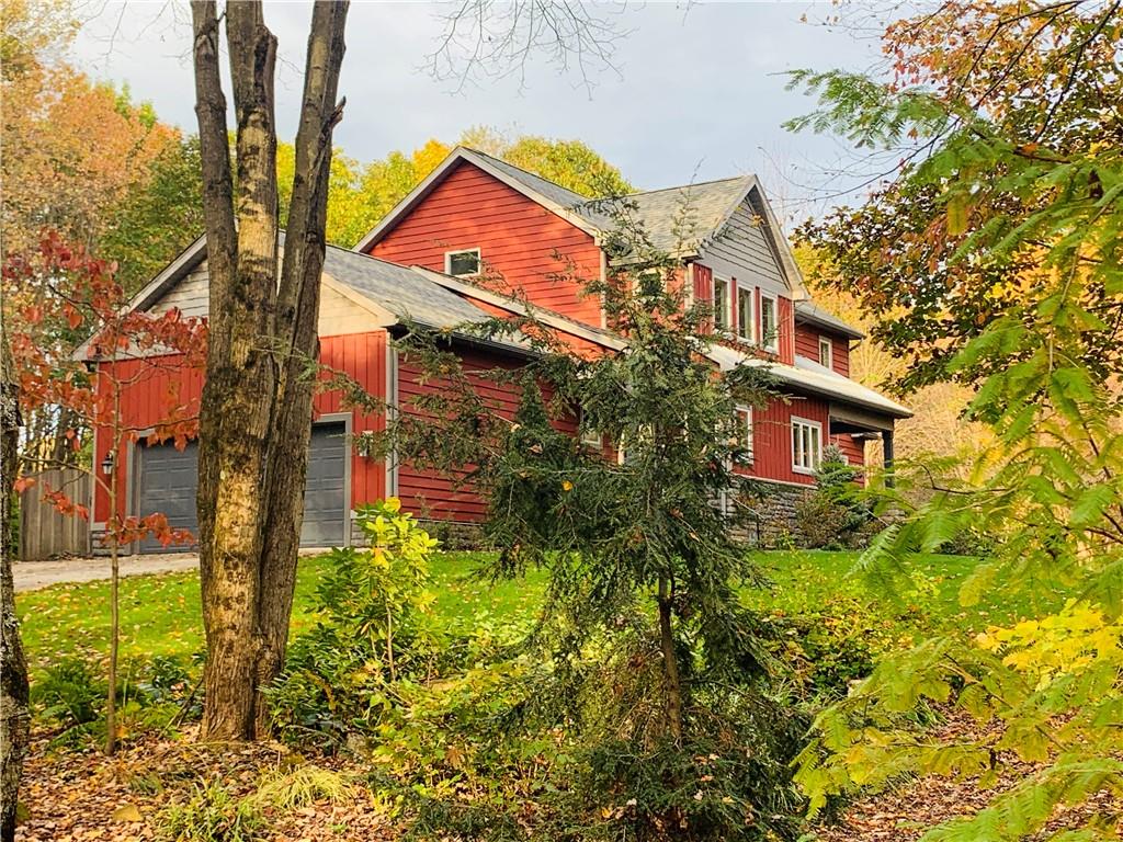 232 Devils Backbone Road New Castle, PA 16102 - Photo 20 of 25 a view of a brick house with a yard and plants