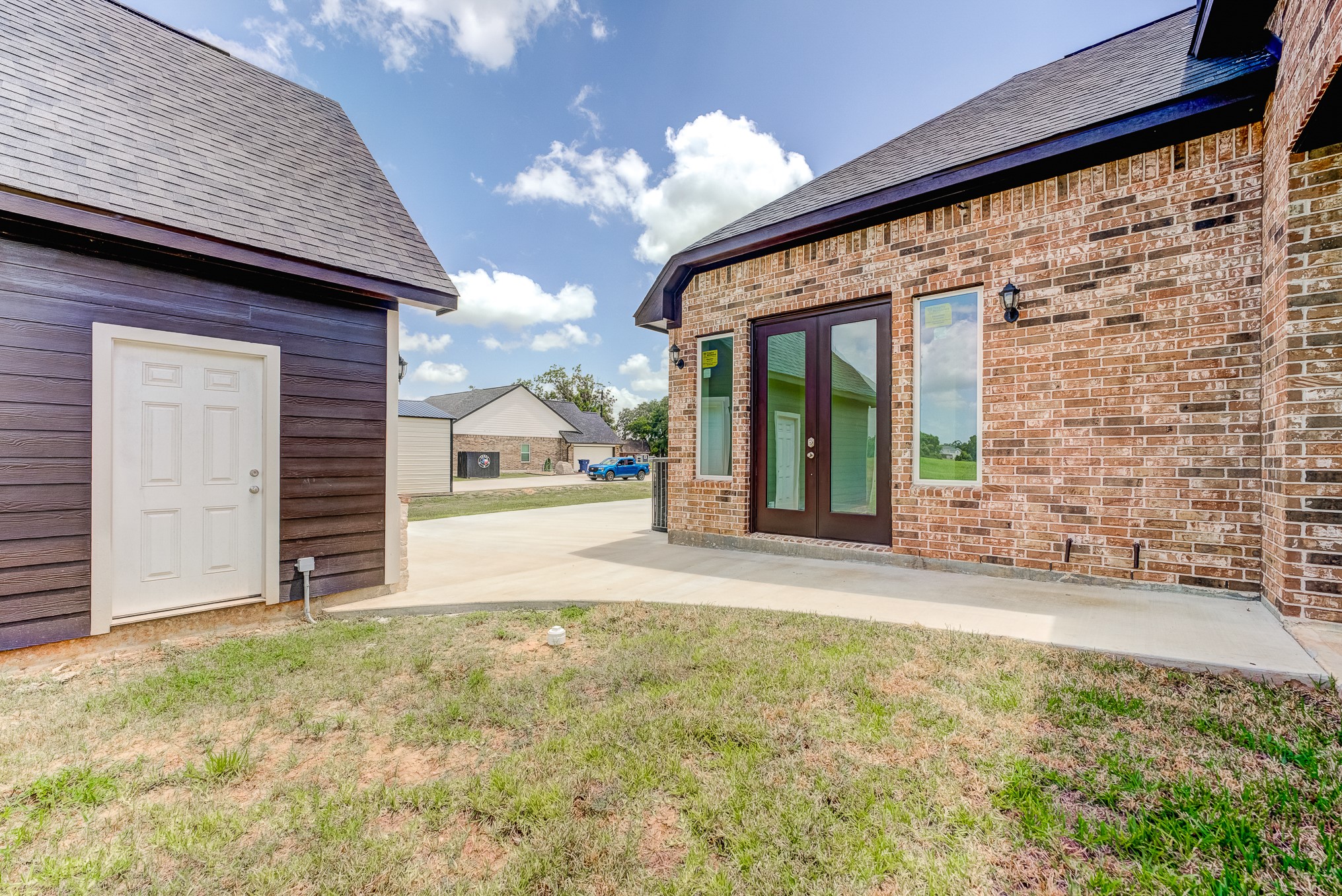 1720 Flintlock Court Angleton, TX 77515 - Photo 33 of 45 Patio with walkway to detached garage
