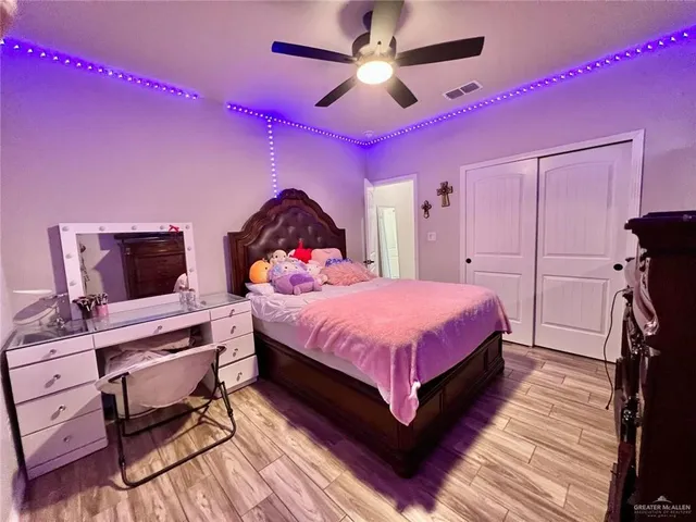 a spacious bedroom with a bed and a desk