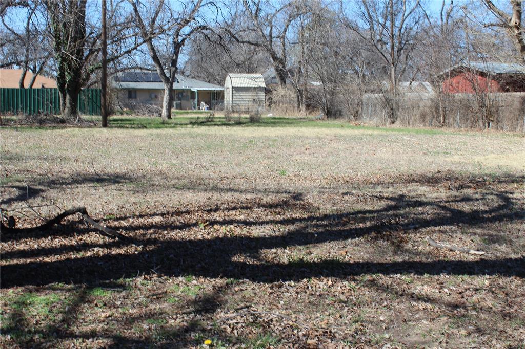220 Rusk Street Clyde, TX 79510 - Photo 2 of 11 a view of a house with a yard