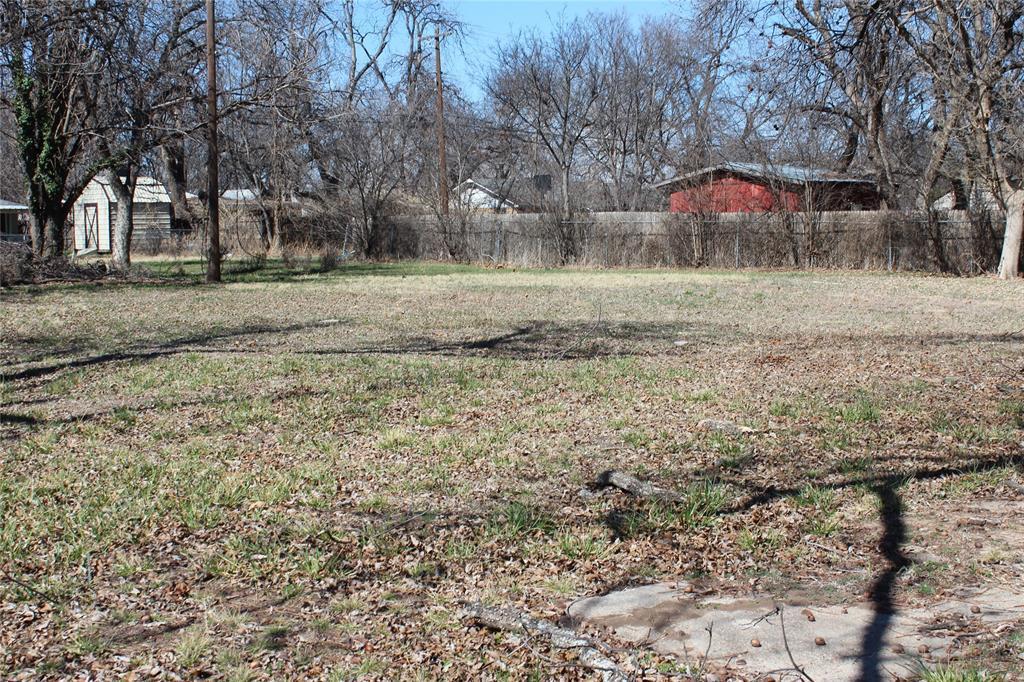 220 Rusk Street Clyde, TX 79510 - Photo 7 of 11 a front view of a house with a yard