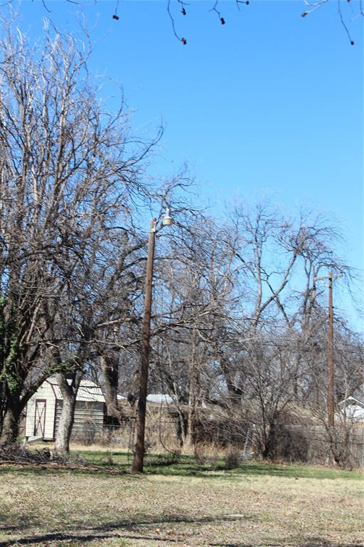 220 Rusk Street Clyde, TX 79510 - Photo 8 of 11 a view of a yard in front of a house