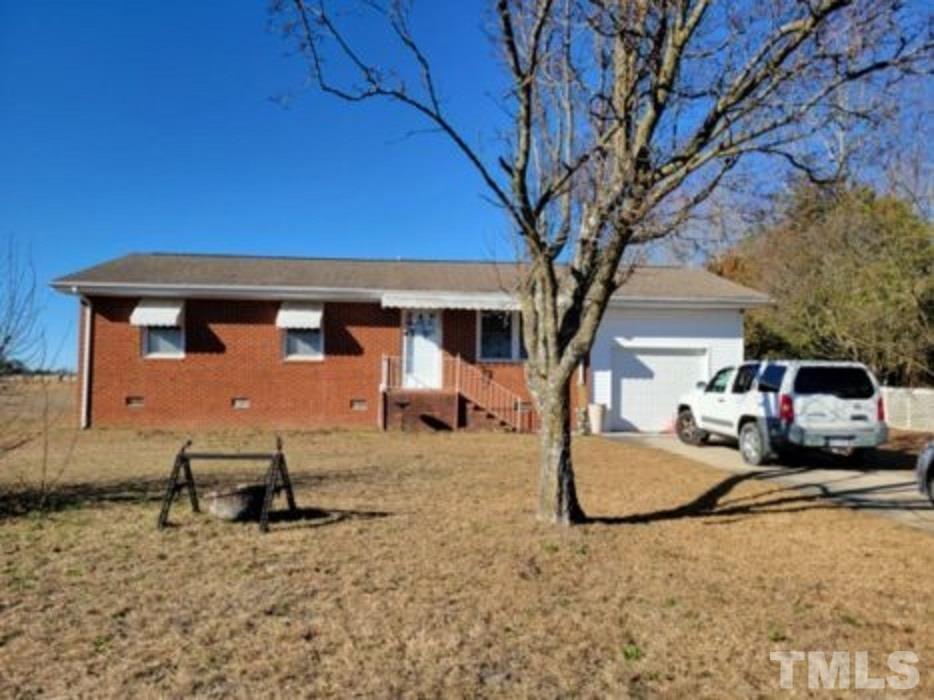 3336 Fairground Road Dunn, NC 28334 - Photo 1 of 11 a view of a house with a backyard