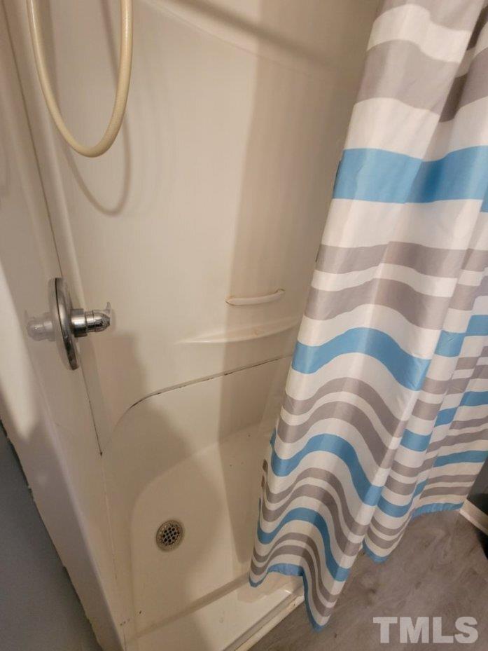 3336 Fairground Road Dunn, NC 28334 - Photo 11 of 11 a bathroom with a sink and a shower