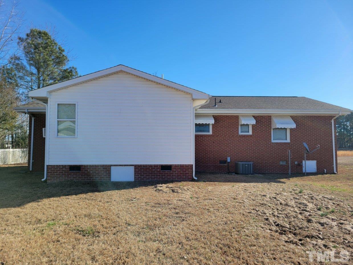 3336 Fairground Road Dunn, NC 28334 - Photo 2 of 11 a front view of a house with a yard