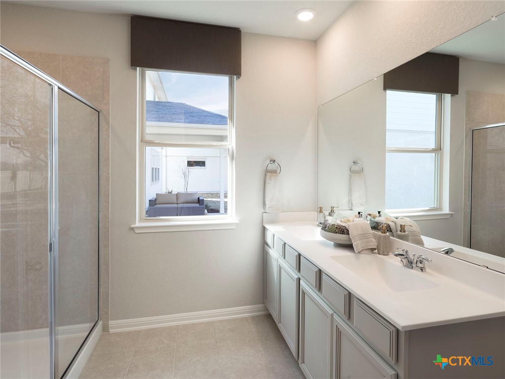 137 Dakota Ridge Cibolo, TX 78108 - Photo 4 of 7 a bathroom with a sink and a mirror