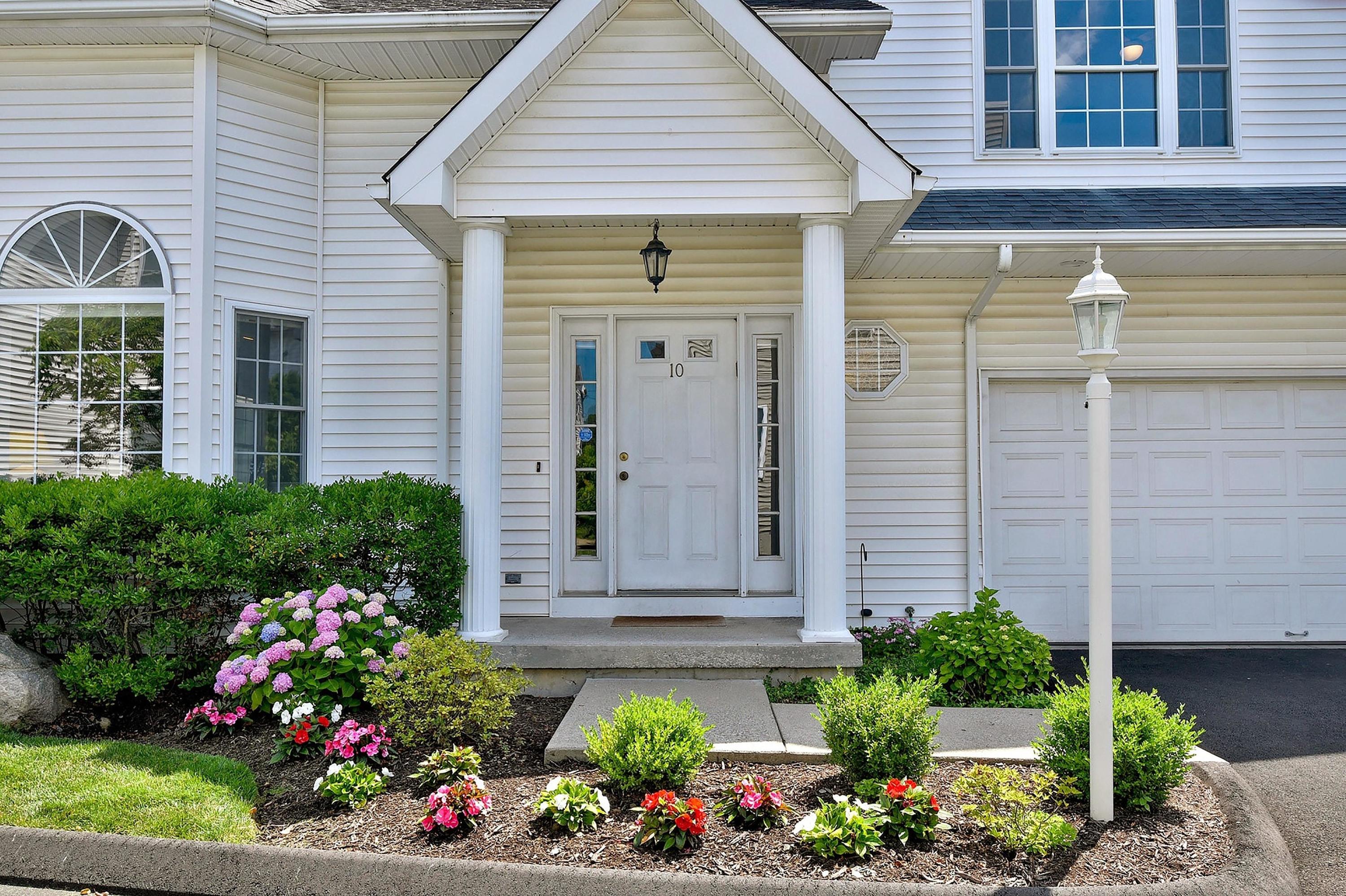 a front view of a house with a yard