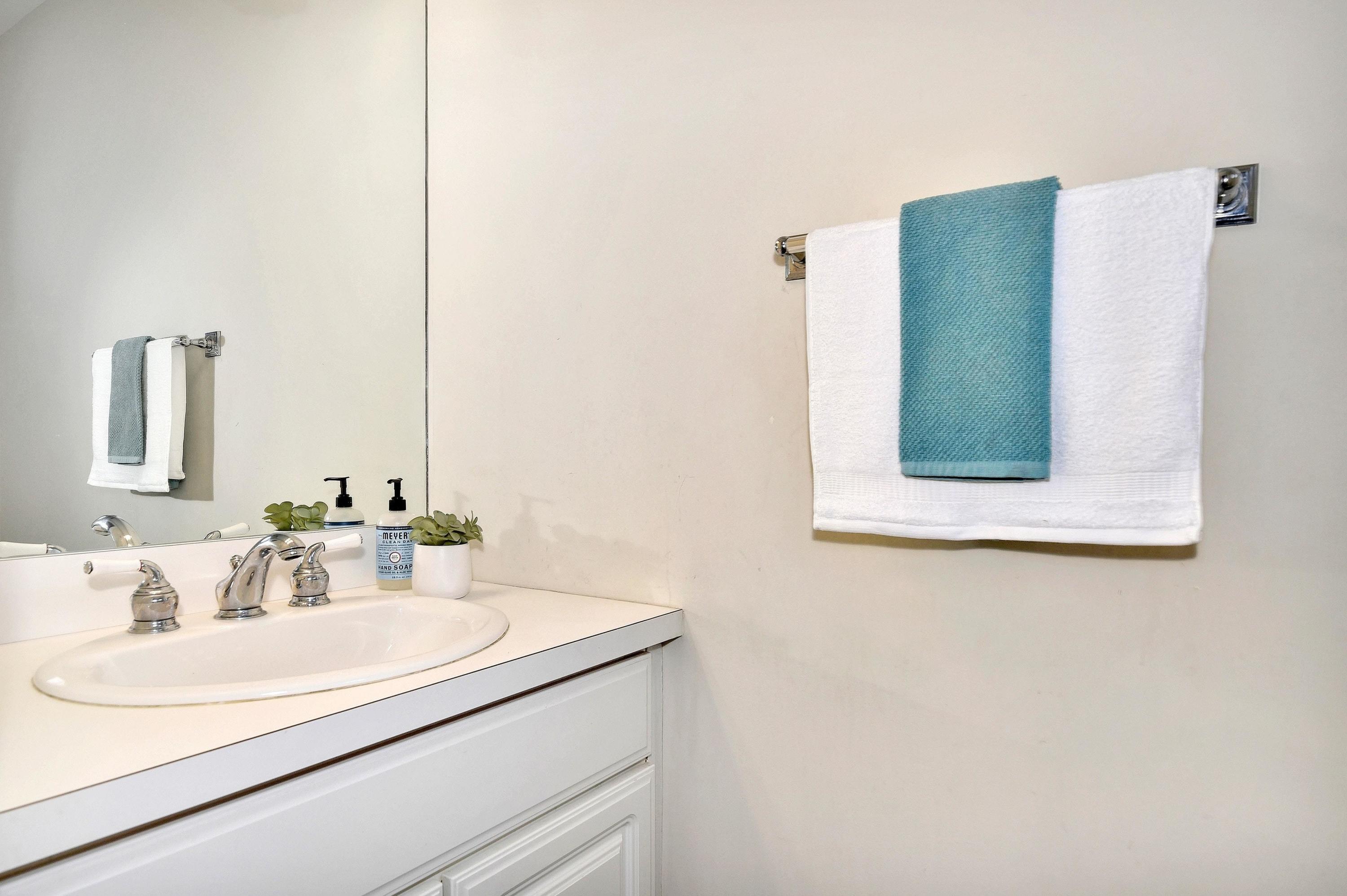168 Colonial Road, Unit 10 Stamford, CT 06906 - Photo 13 of 27 a bathroom with a sink and a mirror