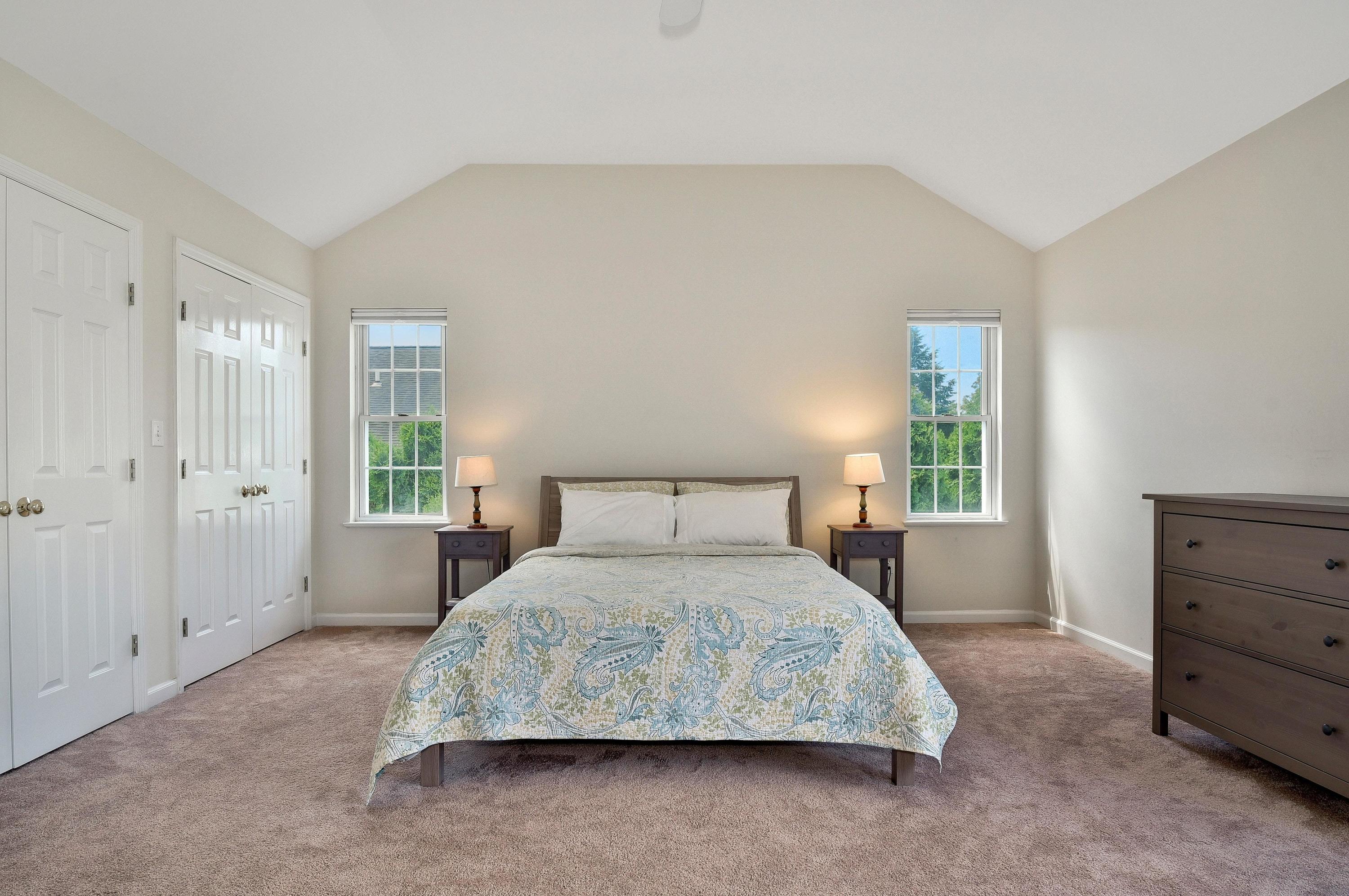168 Colonial Road, Unit 10 Stamford, CT 06906 - Photo 16 of 27 a bedroom with a bed and a dresser
