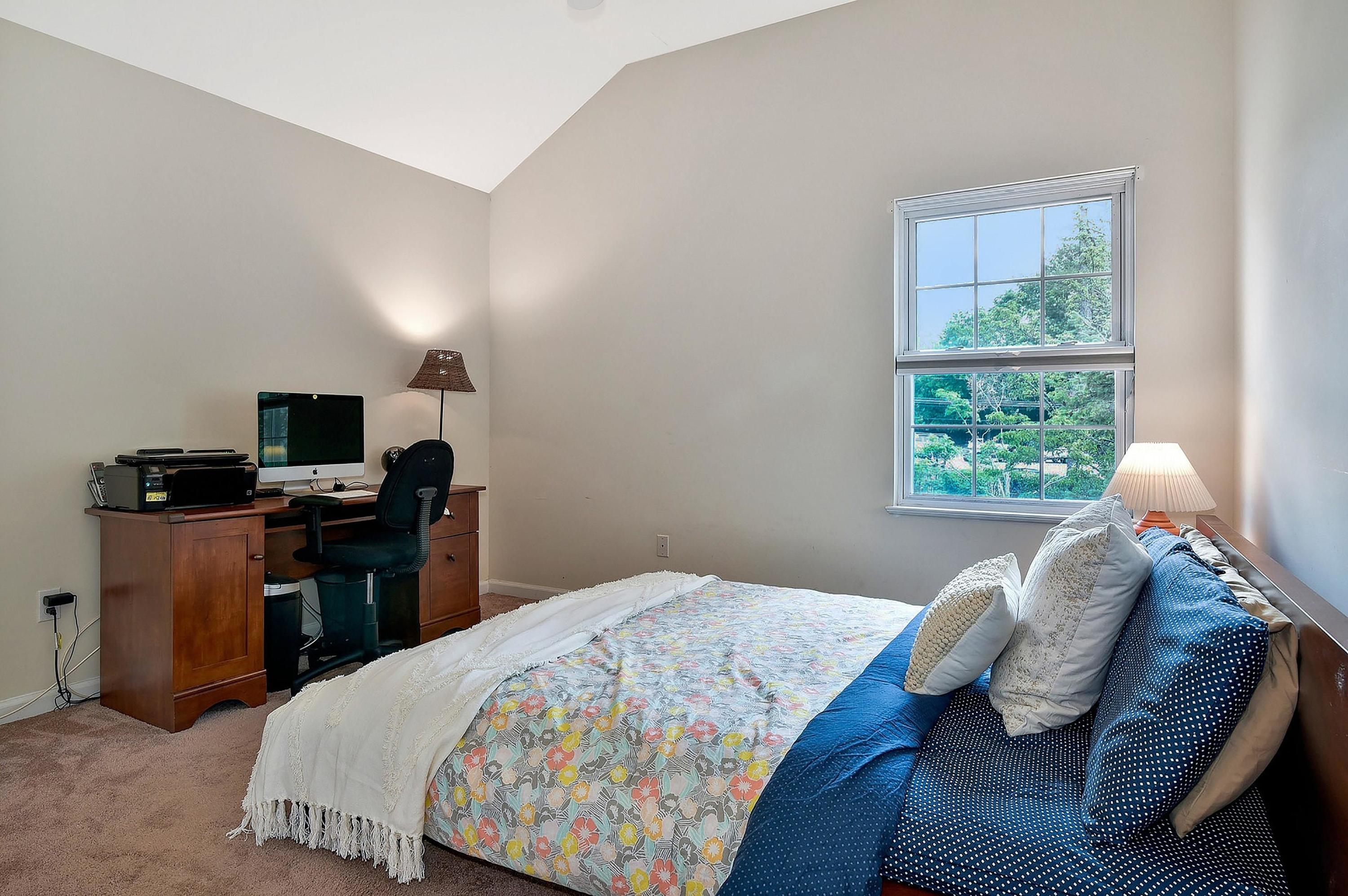 168 Colonial Road, Unit 10 Stamford, CT 06906 - Photo 19 of 27 a bedroom with a bed and wooden floor