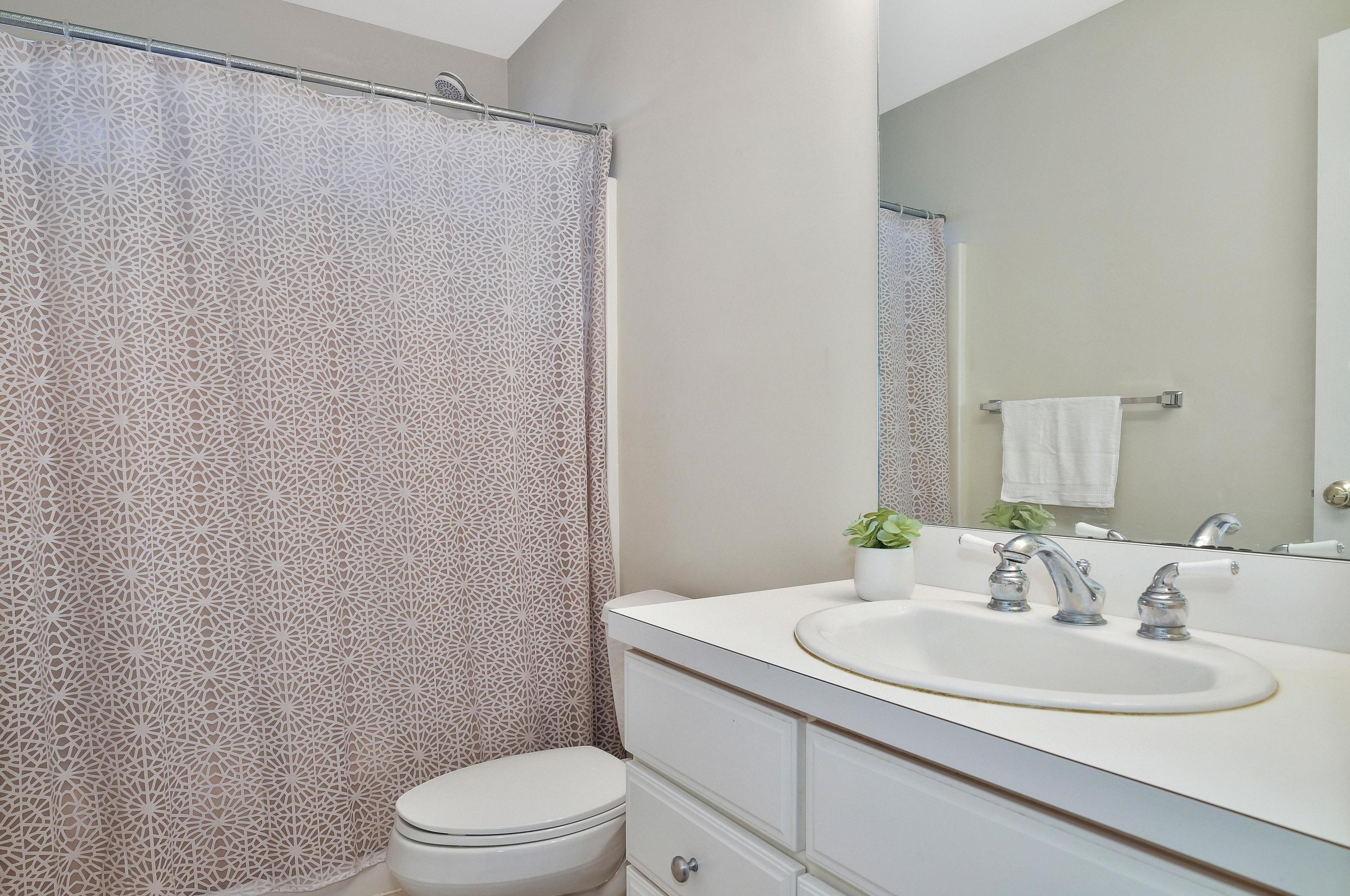 168 Colonial Road, Unit 10 Stamford, CT 06906 - Photo 21 of 27 a bathroom with a sink toilet and vanity