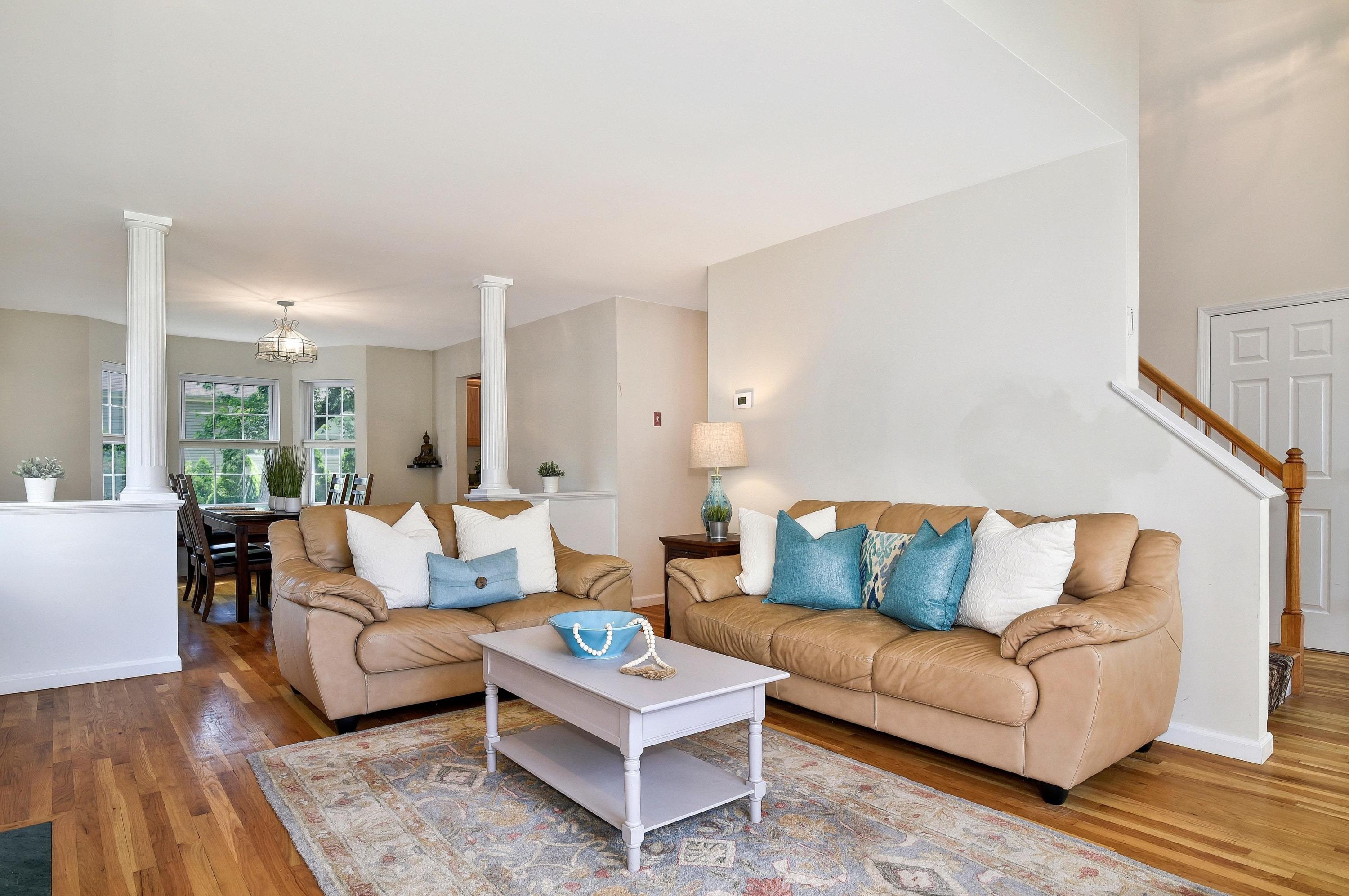 168 Colonial Road, Unit 10 Stamford, CT 06906 - Photo 5 of 27 a living room with furniture and a wooden floor