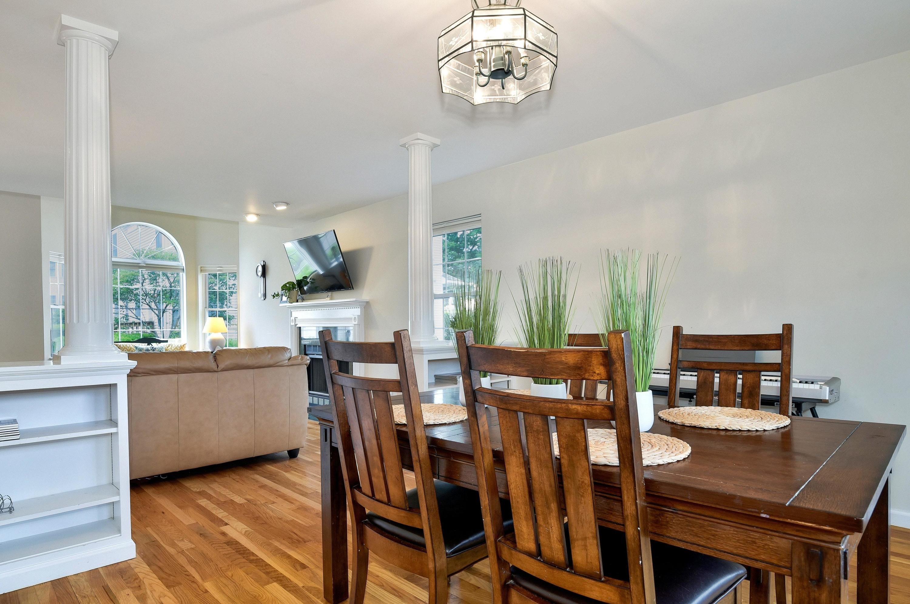 168 Colonial Road, Unit 10 Stamford, CT 06906 - Photo 7 of 27 a view of a dining room with furniture window and wooden floor