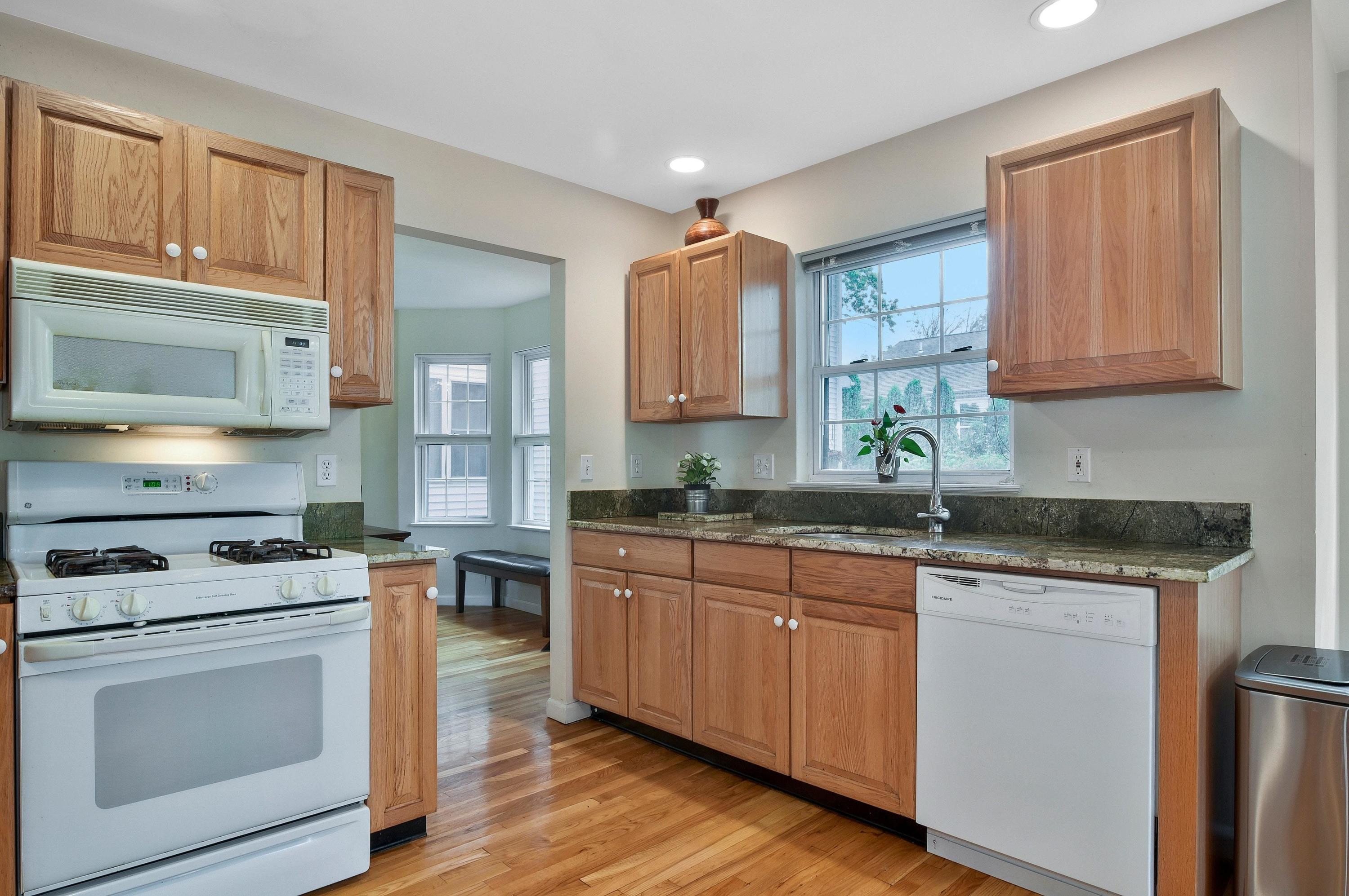 168 Colonial Road, Unit 10 Stamford, CT 06906 - Photo 10 of 27 a kitchen with granite countertop cabinets stainless steel appliances and a sink
