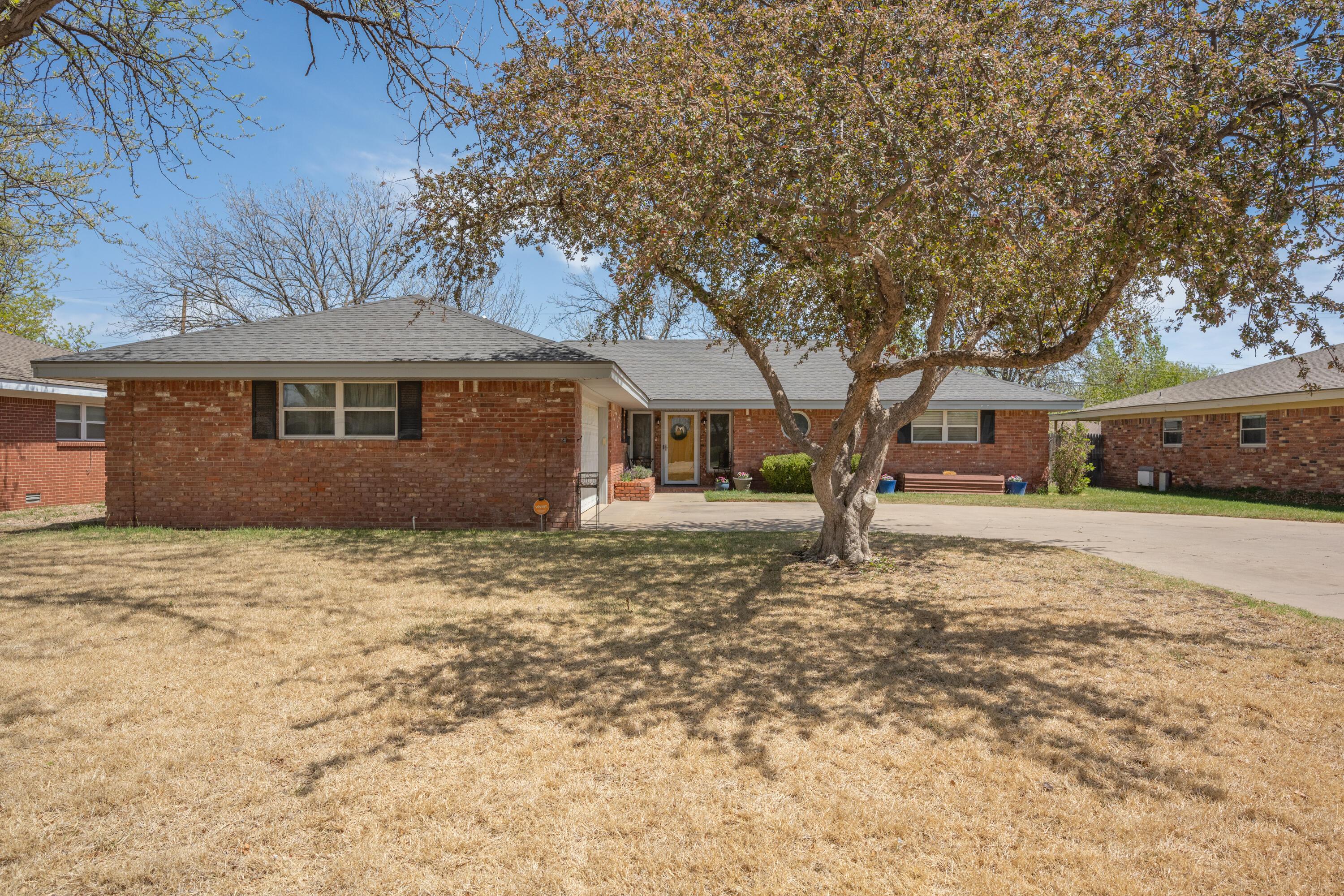 3313 Bedford Road Amarillo, TX 79106 - Photo 2 of 24 a house with trees in front of it
