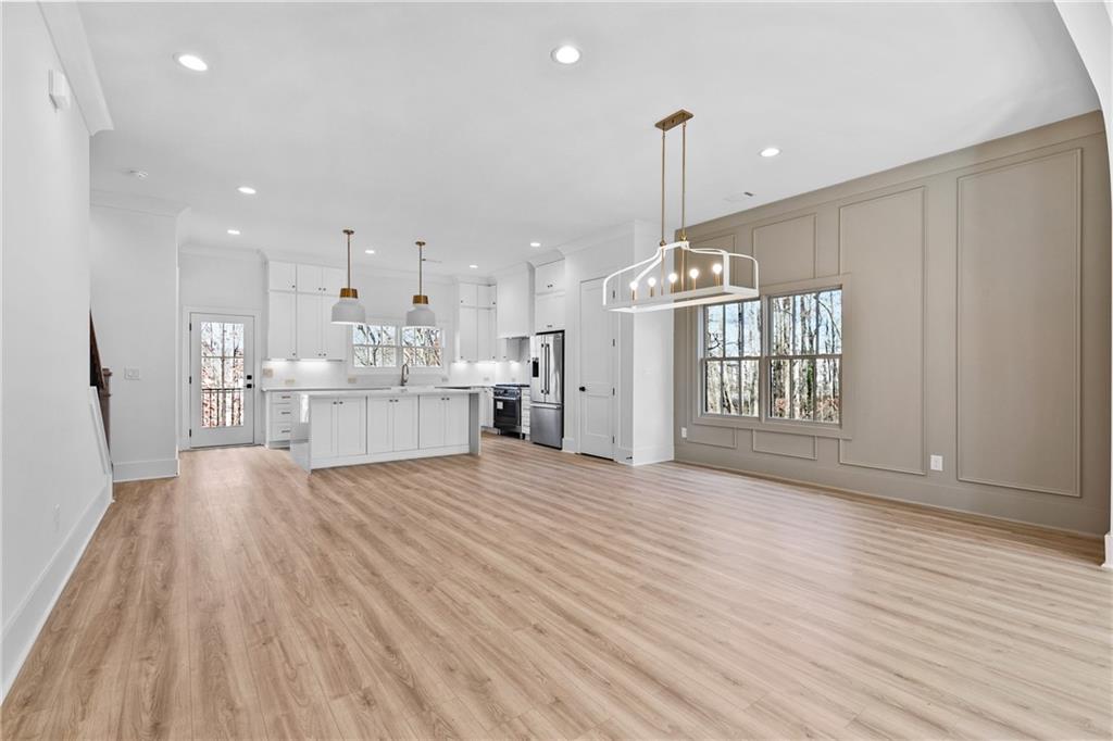 345 Sugarview Road Sugar Hill, GA 30518 - Photo 17 of 66 a view of a kitchen with wooden floor and a window