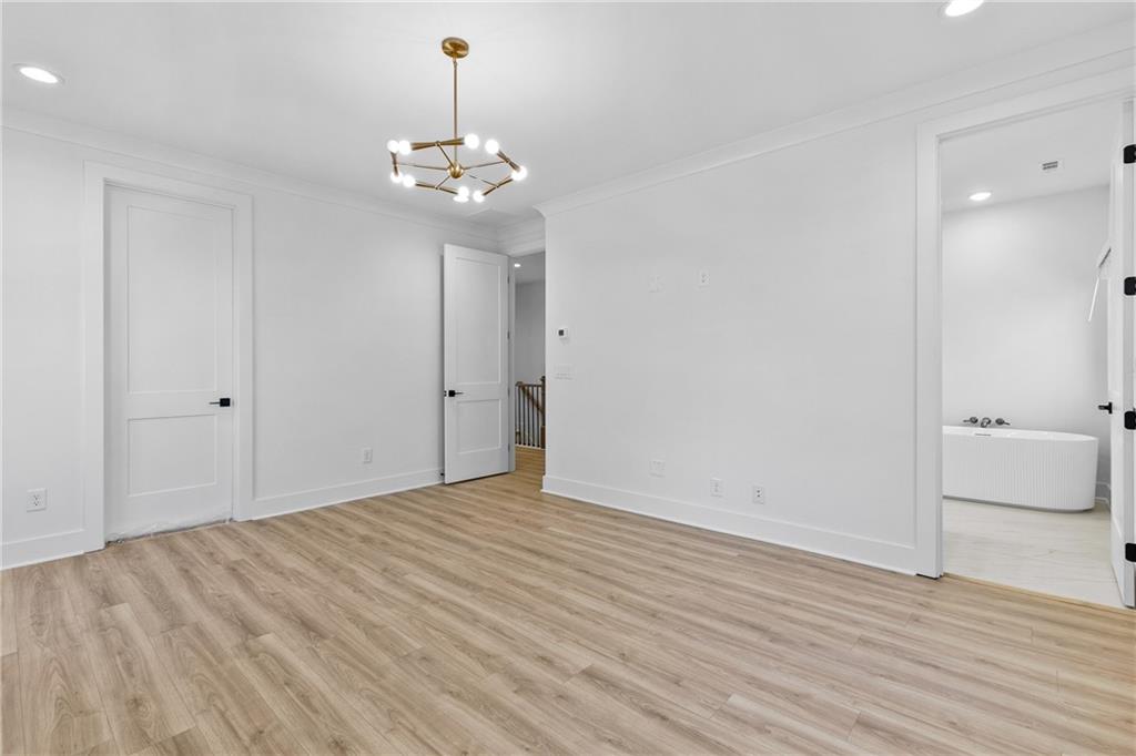 345 Sugarview Road Sugar Hill, GA 30518 - Photo 32 of 66 a view of a room with wooden floor and a ceiling fan