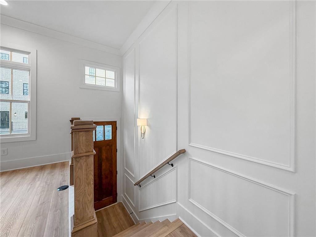 345 Sugarview Road Sugar Hill, GA 30518 - Photo 43 of 66 a view of hallway with window and wooden floor