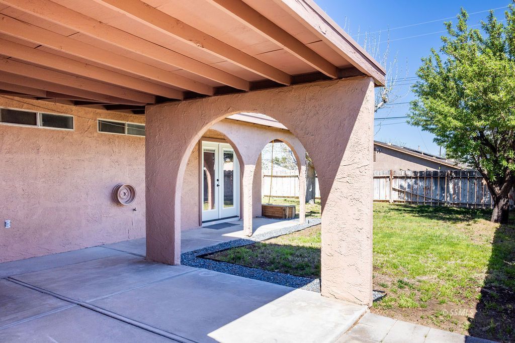 1144 West Benson Avenue Ridgecrest, CA 93555 - Photo 27 of 32 a front view of a house with garden