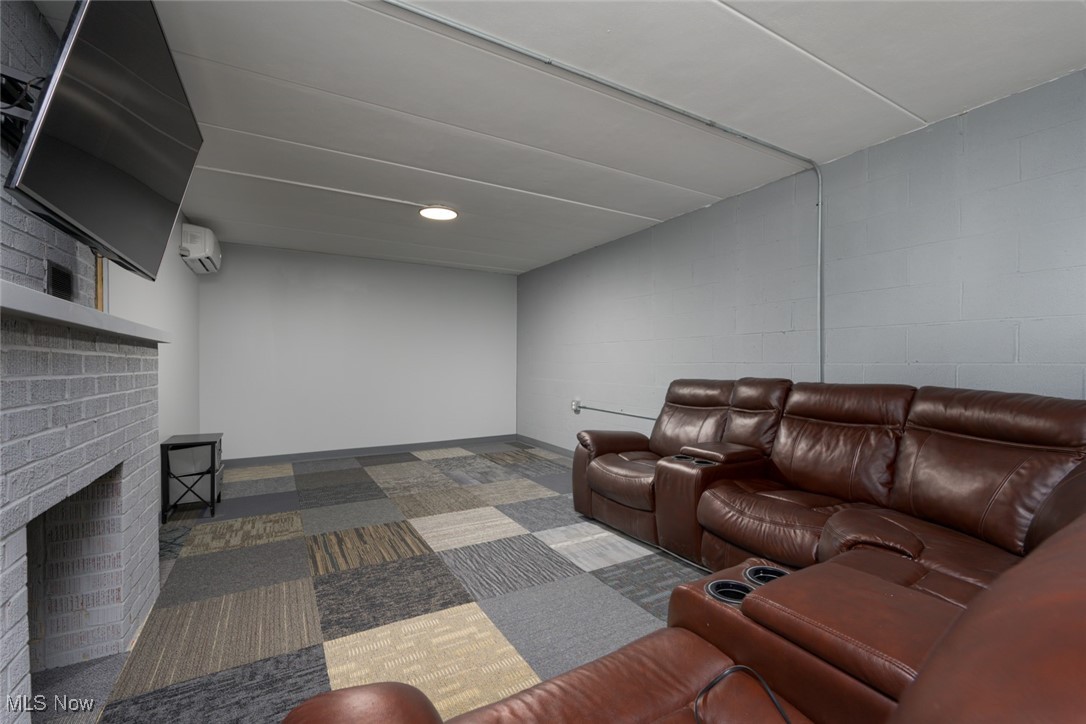 2547 Mogadore Road Akron, OH 44312 - Photo 20 of 31 Carpeted living room with a brick fireplace