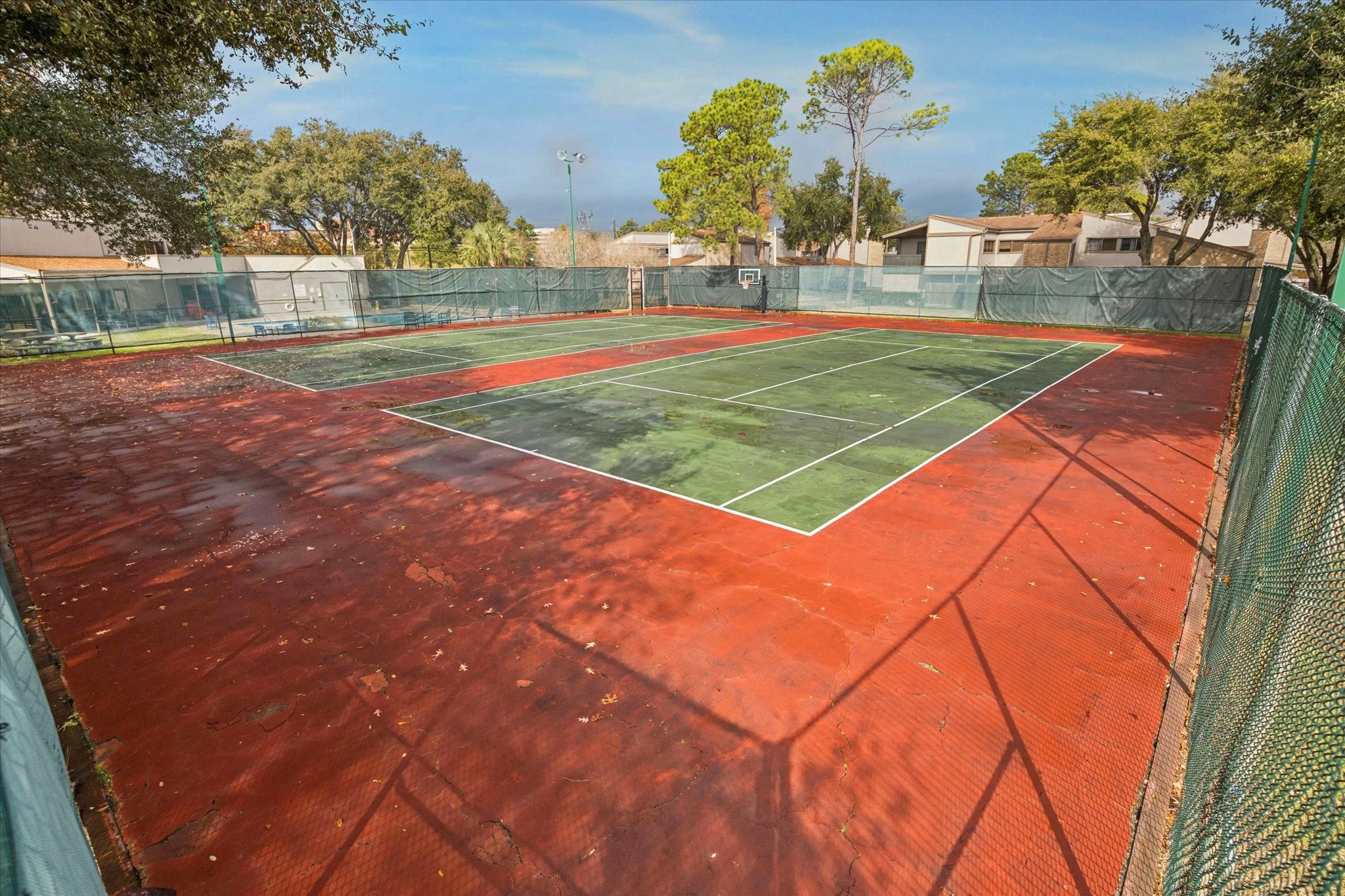 880 Tully Street, Unit 13 Houston, TX 77079 - Photo 23 of 27 a view of an outdoor space and tennis court