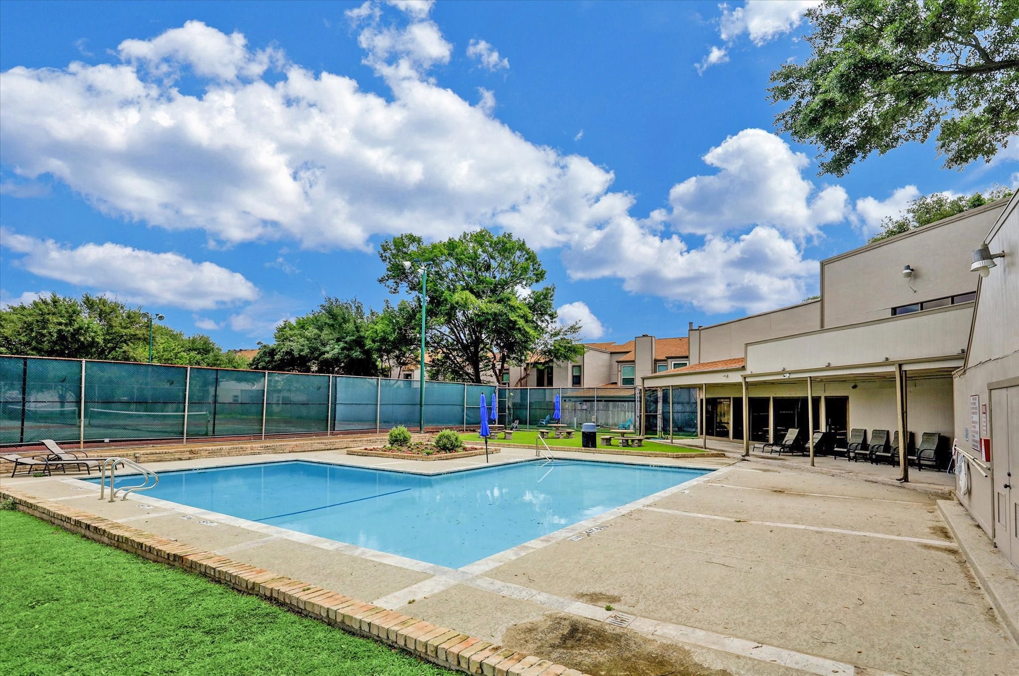 880 Tully Street, Unit 13 Houston, TX 77079 - Photo 5 of 27 a view of a house with swimming pool and porch with furniture