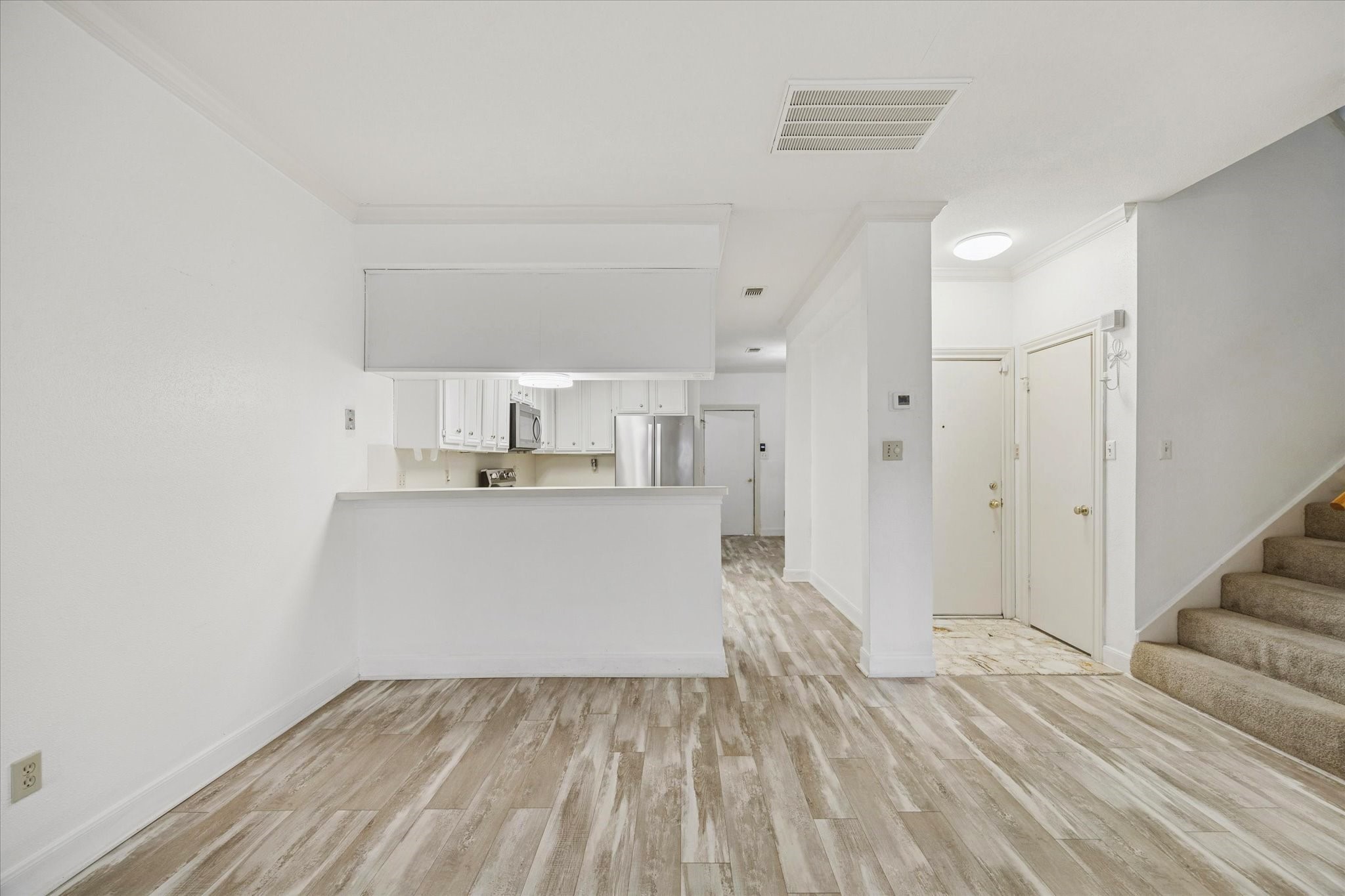 880 Tully Street, Unit 13 Houston, TX 77079 - Photo 10 of 27 a view of kitchen with wooden floor