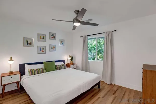 a bedroom with a bed and window