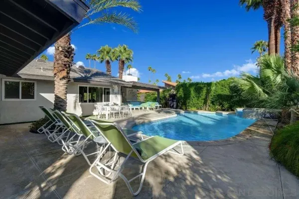 a view of a house with swimming pool
