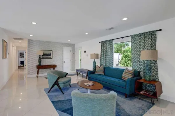 a living room with furniture and a large window
