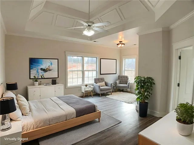 a spacious bedroom with a bed and a chandelier