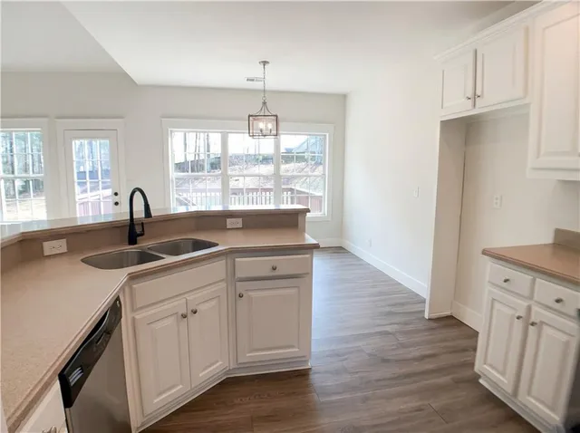 a kitchen with sink and window