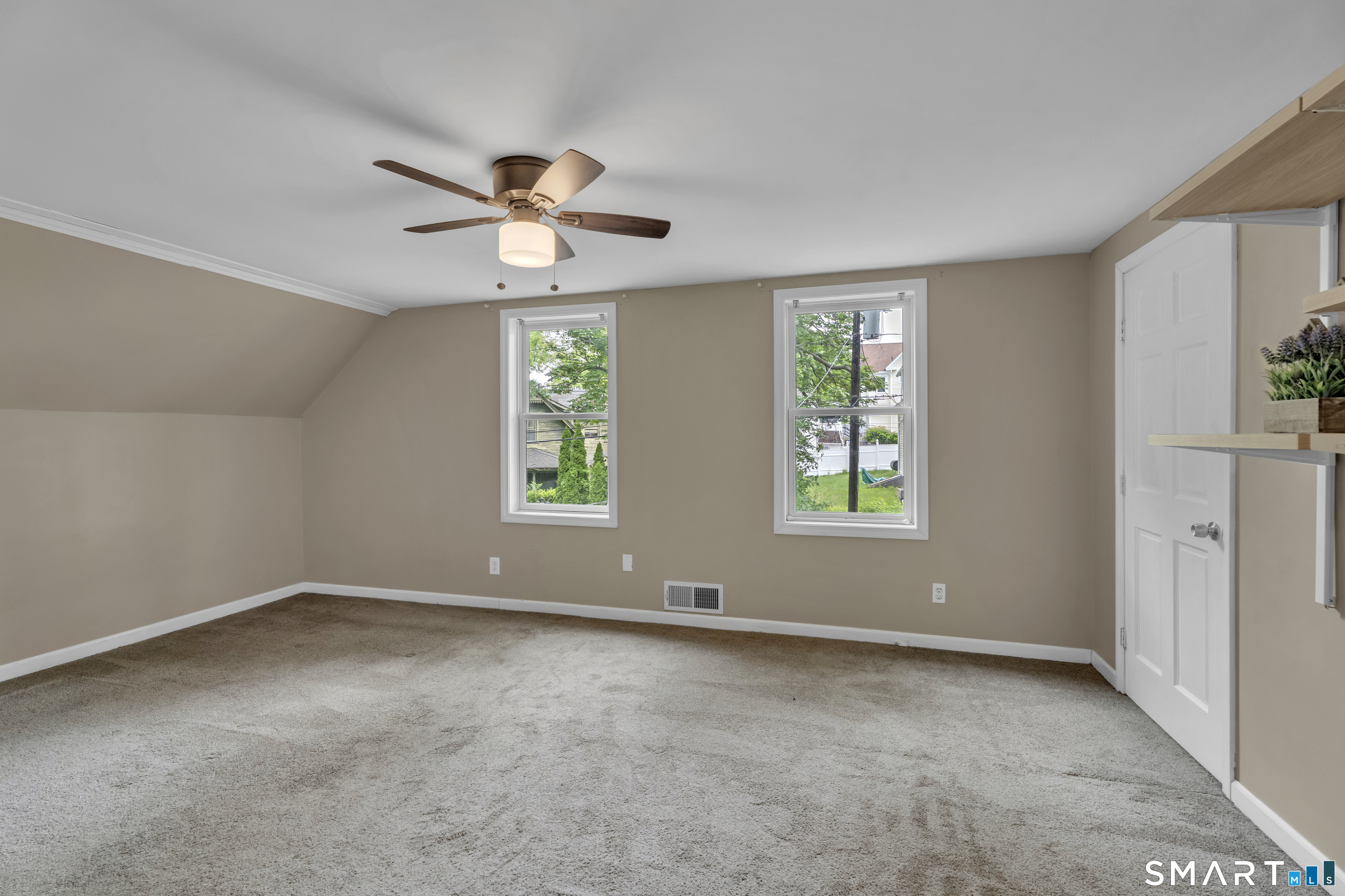 75 Summit Street Norwich, CT 06360 - Photo 31 of 40 an empty room with windows and fan