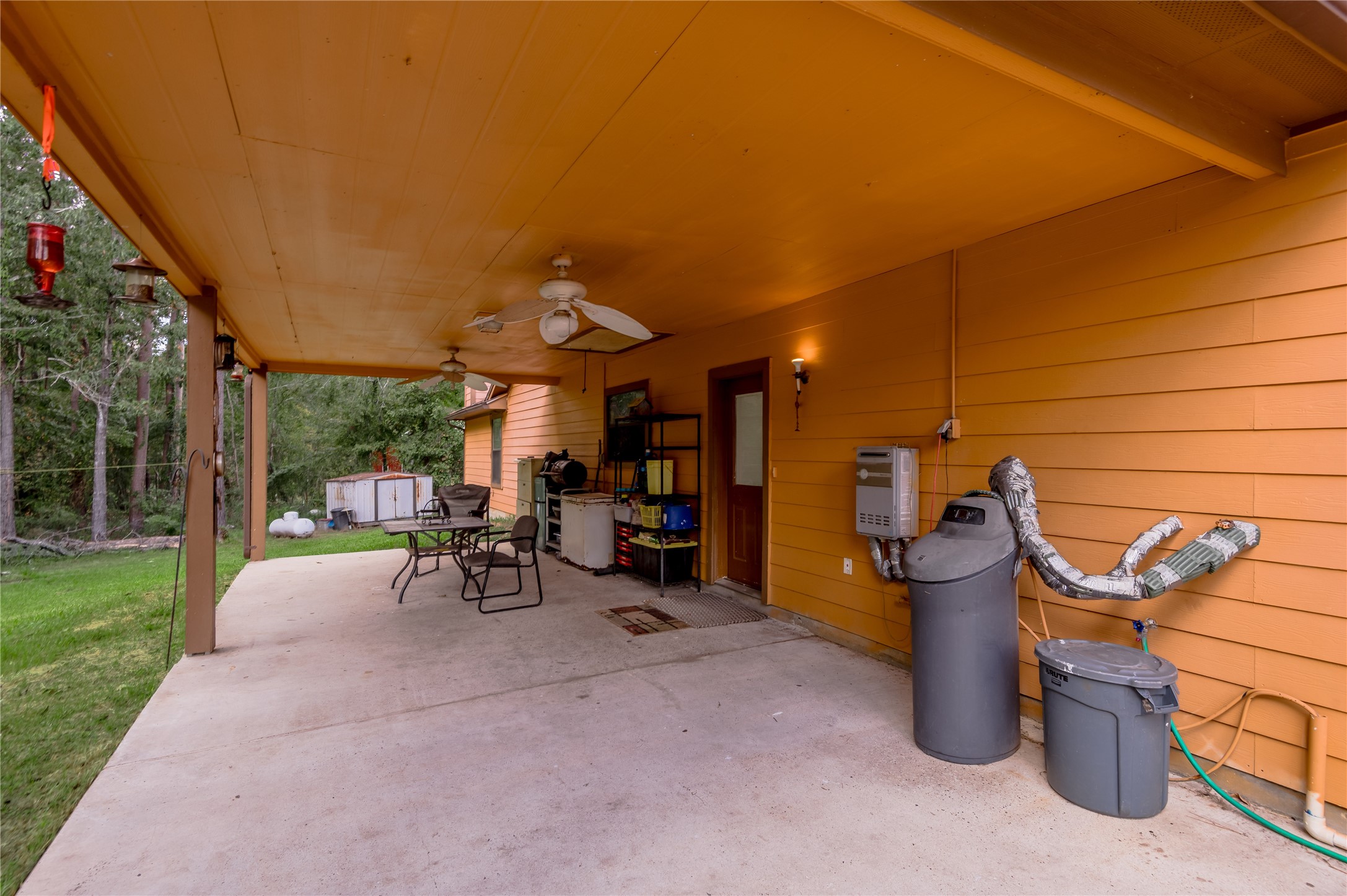 47-57 Stage Coach Road Coldspring, TX 77331 - Photo 28 of 50 a view of a patio with a table and chairs and a barbeque