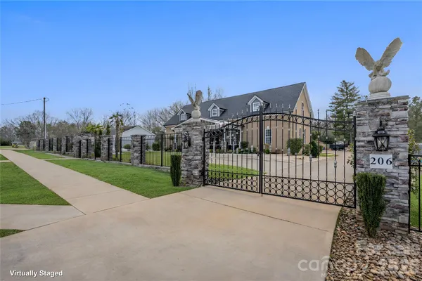 a view of a wrought iron fences in front of house