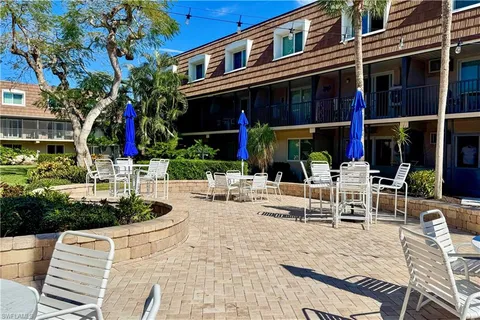 a view of a chairs and tables in patio of a house