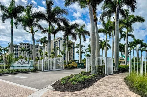 a view of a park with a palm trees