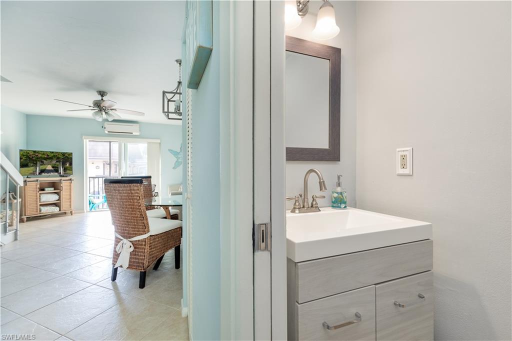 87 North Collier Boulevard, Unit J18 Marco Island, FL 34145 - Photo 7 of 21 Half bath downstairs