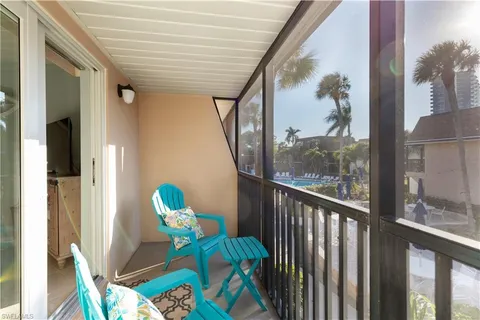 a view of balcony with furniture and garden