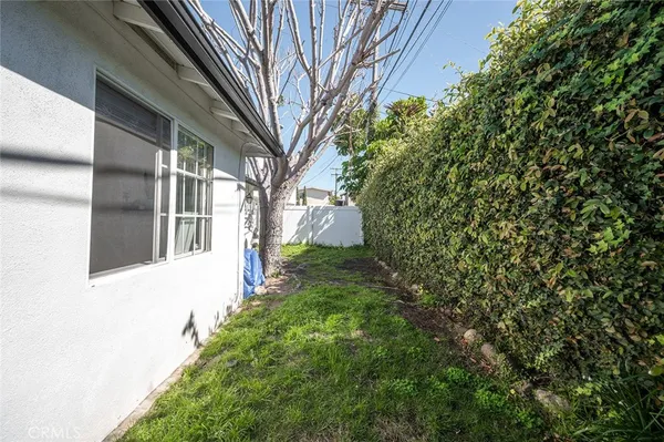 a backyard of a house with lots of green space