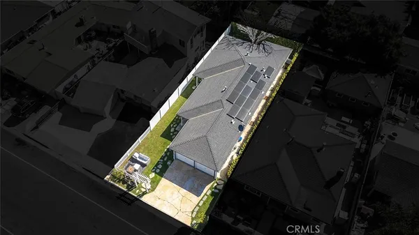 an aerial view of a house with outdoor space